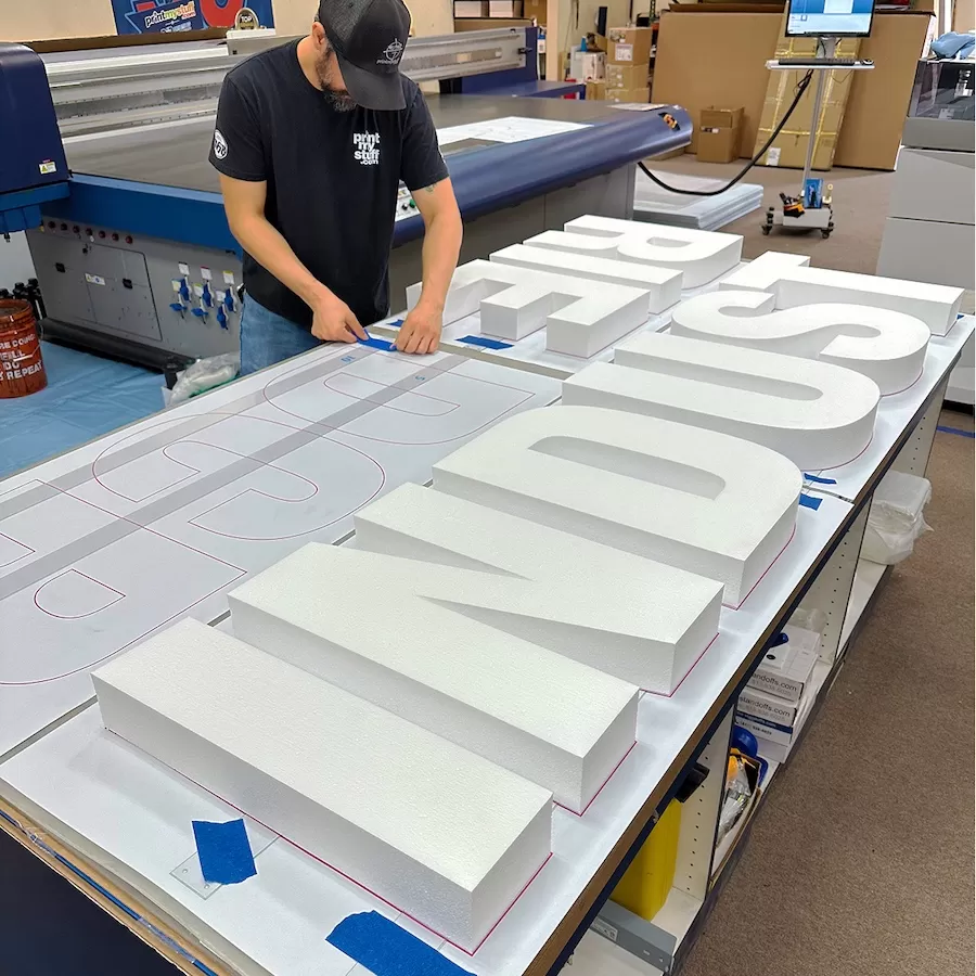 Floating Letters Sign: Industrie x DCR